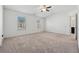 Spacious bedroom with neutral carpeting and ample natural light at 7633 Summer Berry Ln, Lithonia, GA 30038