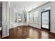 Bright dining room with hardwood floors, bay window, and access to the backyard at 7633 Summer Berry Ln, Lithonia, GA 30038