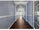 Bright entryway with hardwood floors, neutral walls, and an arched passage at 7633 Summer Berry Ln, Lithonia, GA 30038