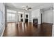 Spacious living room with hardwood floors, fireplace, and built-in shelving at 7633 Summer Berry Ln, Lithonia, GA 30038