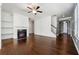 Living room with hardwood floors, fireplace, and built-in shelving at 7633 Summer Berry Ln, Lithonia, GA 30038