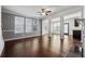 Living room with hardwood floors, ceiling fan, fireplace, and open floor plan at 7633 Summer Berry Ln, Lithonia, GA 30038