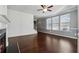 Living room with hardwood floors, fireplace, and view to the staircase at 7633 Summer Berry Ln, Lithonia, GA 30038