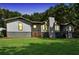 Modern ranch house with lit windows at night, and a large grassy yard at 2784 Sixes Rd, Canton, GA 30114