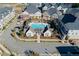 Aerial view of the pool and residential area in a Primary planned community with tree lined streets at 3879 Allegretto Cir # 116, Atlanta, GA 30339