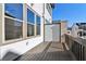 Private outdoor balcony with stained wood floors and aluminum railings at 3879 Allegretto Cir # 116, Atlanta, GA 30339