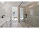 Bright bathroom with a glass enclosed shower, gray tile, and black shower hardware at 3879 Allegretto Cir # 116, Atlanta, GA 30339