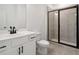 Modern bathroom showcasing sleek vanity, black hardware, and glass-enclosed walk-in shower at 3879 Allegretto Cir # 116, Atlanta, GA 30339