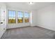 Bright bedroom with large windows offering natural light and views of colorful trees at 3879 Allegretto Cir # 116, Atlanta, GA 30339