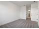 Cozy bedroom featuring neutral carpet, white walls, and doorways to other rooms at 3879 Allegretto Cir # 116, Atlanta, GA 30339