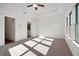Bedroom featuring plush carpet, tray ceiling with ceiling fan, and natural light from the windows at 3879 Allegretto Cir # 116, Atlanta, GA 30339