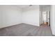 Bedroom with neutral carpet and ample space, leading to another room at 3879 Allegretto Cir # 116, Atlanta, GA 30339