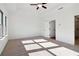 Bedroom featuring plush carpet, tray ceiling with ceiling fan, and natural light from the windows at 3879 Allegretto Cir # 116, Atlanta, GA 30339