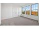 Bedroom featuring plush carpet, large windows with natural light, and a double-door closet at 3879 Allegretto Cir # 116, Atlanta, GA 30339