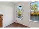 Bright entryway with a white door, hardwood floors, and a large window view at 3879 Allegretto Cir # 116, Atlanta, GA 30339