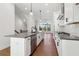 Open kitchen with a large island, stainless appliances, and seamless flow into adjacent rooms at 3879 Allegretto Cir # 116, Atlanta, GA 30339