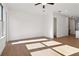 Bright, empty living room showcases the hardwood floors and neutral color palette at 3879 Allegretto Cir # 116, Atlanta, GA 30339