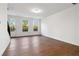 Bright living area featuring hardwood floors, natural light, and views of the outdoors at 3879 Allegretto Cir # 116, Atlanta, GA 30339