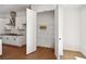 Bright pantry with multiple shelves and open access to the kitchen with stainless steel appliances at 3879 Allegretto Cir # 116, Atlanta, GA 30339
