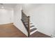 Dark wood staircase with white walls leading to the upper floor at 3879 Allegretto Cir # 116, Atlanta, GA 30339