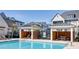 Outdoor swimming pool with lounge chairs, picnic seating, and sunshades at 3879 Allegretto Cir # 116, Atlanta, GA 30339