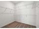 Unfurnished walk-in closet with carpeted floors and white wire shelving at 3879 Allegretto Cir # 116, Atlanta, GA 30339