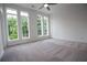 Bright bedroom with large windows and gray carpet at 530 Sawnee Village Blvd # D63, Cumming, GA 30040