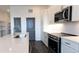 Modern kitchen with stainless steel appliances and white cabinetry at 556 Sawnee Village Blvd # D76, Cumming, GA 30040