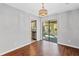 This dining area has laminate floors, neutral paint, pendant lighting and access to the kitchen and screened in porch at 4195 Jeanette Ct, Norcross, GA 30093