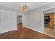 This dining room is spacious with closet space, laminate flooring, pendant lighting and access to the kitchen at 4195 Jeanette Ct, Norcross, GA 30093