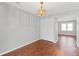 The dining room has wood-look laminate floors, a closet, and a stylish pendant light fixture at 4195 Jeanette Ct, Norcross, GA 30093