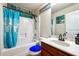 Clean bathroom with teal accents and a tub shower combo at 5901 Seabright Ln, Atlanta, GA 30349