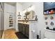 Modern bathroom with dark vanity, double sinks, and tile flooring at 5901 Seabright Ln, Atlanta, GA 30349