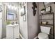 Small bathroom with white vanity, toilet, and gray walls at 5901 Seabright Ln, Atlanta, GA 30349