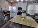 Eat-in kitchen with granite countertops and ample cabinet space at 5901 Seabright Ln, Atlanta, GA 30349