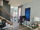 Living room with gray walls, wood-look floors, and a home office at 5901 Seabright Ln, Atlanta, GA 30349