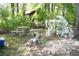 Secluded backyard featuring garden, rock features, and mature landscaping at 4120 Highway 92, Acworth, GA 30102