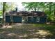 View of the home's backyard featuring patio, grill, and lawn at 4120 Highway 92, Acworth, GA 30102