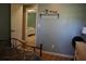 Bedroom with an open doorway, decorative shelf, bed and a light-colored dresser at 4120 Highway 92, Acworth, GA 30102