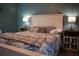 Bedroom featuring a comfortable bed with a decorative headboard, pillows, and matching side tables at 4120 Highway 92, Acworth, GA 30102