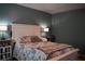 This bedroom has a light wooden bed frame and matching side tables with lamps at 4120 Highway 92, Acworth, GA 30102