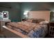 This bedroom has a light wooden bed frame and a vanity with lighting at 4120 Highway 92, Acworth, GA 30102