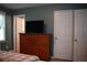 Inviting bedroom with television on wooden dresser, and white closets at 4120 Highway 92, Acworth, GA 30102