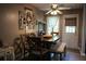 Cozy dining area features a wooden table, stylish chairs, and natural light from the adjacent door at 4120 Highway 92, Acworth, GA 30102