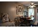Cozy dining area features a wooden table, stylish chairs, and natural light from the adjacent door at 4120 Highway 92, Acworth, GA 30102