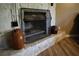 Stone fireplace with mantle and metal screen adds warmth and character to the living space at 4120 Highway 92, Acworth, GA 30102