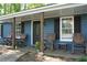 Welcoming front porch with rocking chairs and decorative touches, creating a comfortable entryway at 4120 Highway 92, Acworth, GA 30102