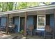 Welcoming porch with rocking chairs and decorative flowers, perfect for enjoying the outdoors at 4120 Highway 92, Acworth, GA 30102