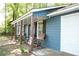 Inviting porch with rocking chairs and natural wood posts, offering a cozy outdoor space at 4120 Highway 92, Acworth, GA 30102