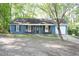 Charming single-story home with a covered porch, blue siding, and inviting curb appeal at 4120 Highway 92, Acworth, GA 30102